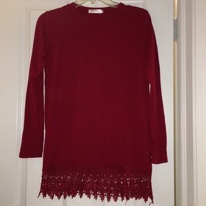 Red long sleeved shirt with bottom detailing